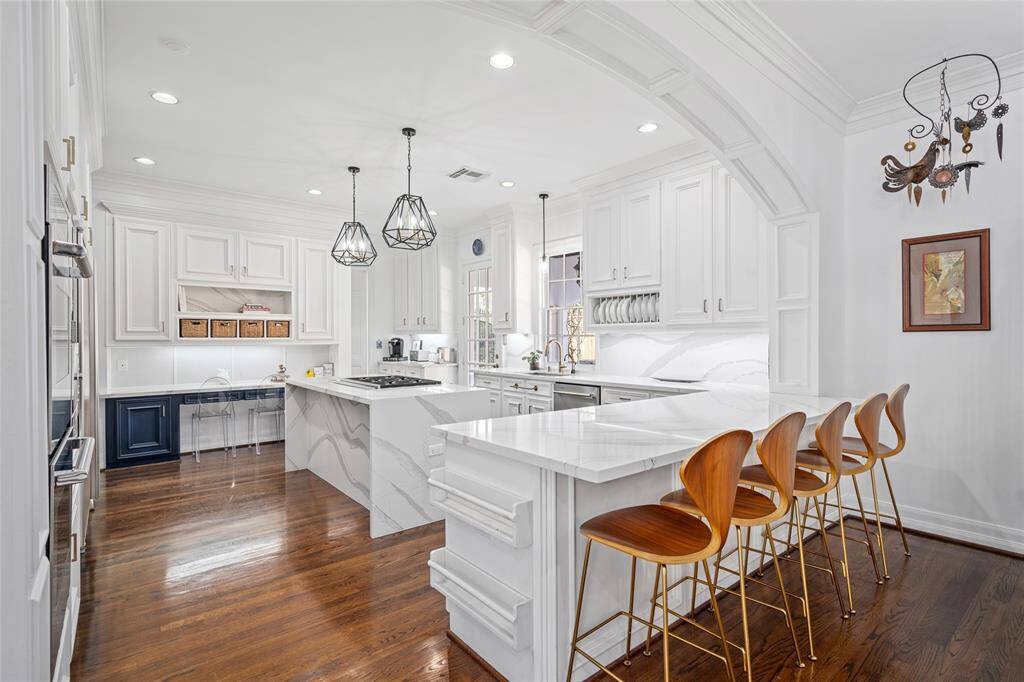 Gourmet kitchen updated in 2019 with Silestone quartz countertops, top-of-the-line stainless steel appliances,& Sub-Zero refrigerator.