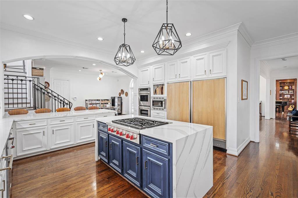 Gourmet kitchen updated in 2019 with Silestone quartz countertops, top-of-the-line stainless steel appliances,& Sub-Zero refrigerator.
