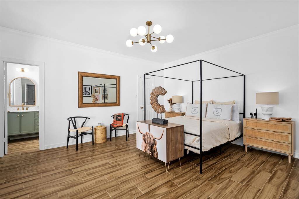 Secondary bedroom fully remodeled and overlooking backyard has en-suite bathroom and walk in closet.