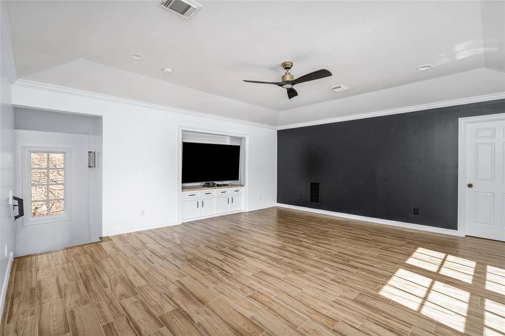 Upstairs game room or theater room, with 2nd staircase that leads down to kitchen area