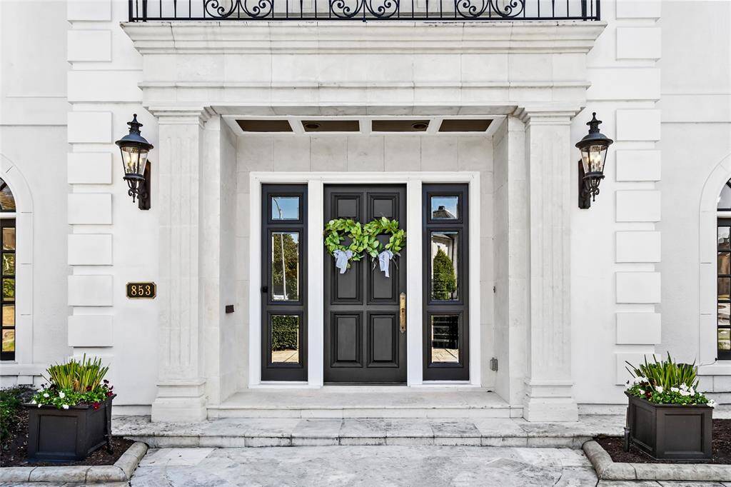 Elegant front entrance in limestone
