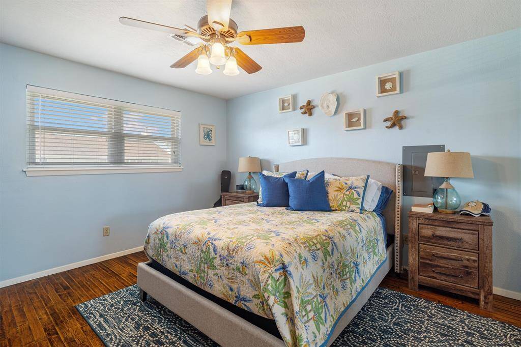 The primary bedroom is painted a coastal color and exudes relaxation
