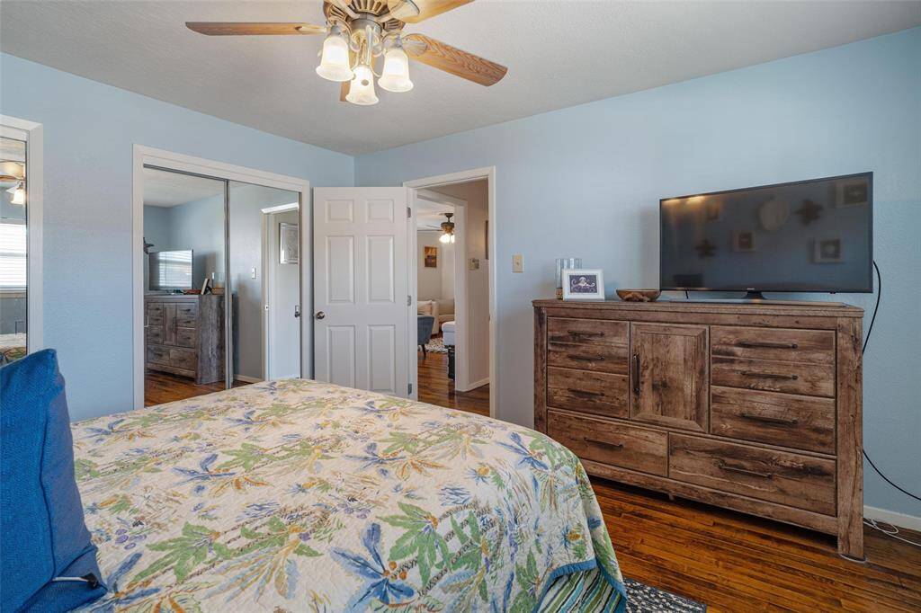 The primary bedroom has an entire wall of closets with plenty of storage space