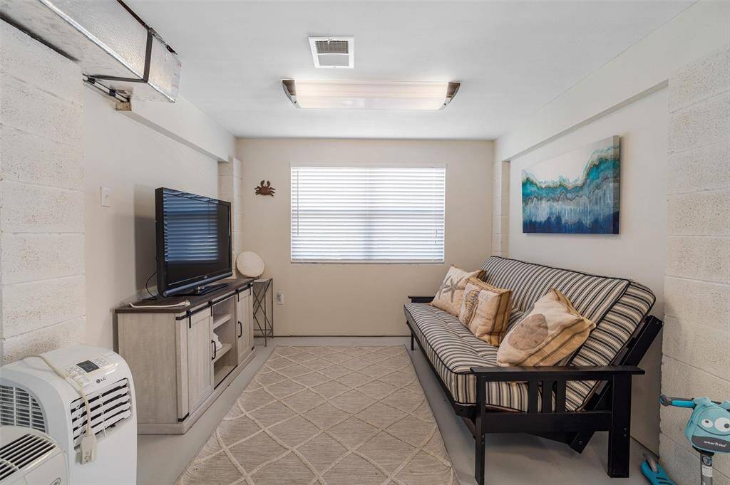 The downstairs enclosed room has central AC/Heat. This section is currently used as another living area, but this could be a 3rd bedroom