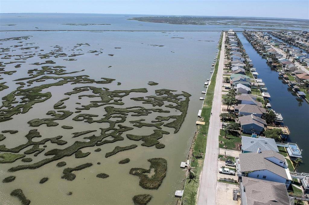 Aerial view of the marsh land towards Galveston and beyond is Jones Lake