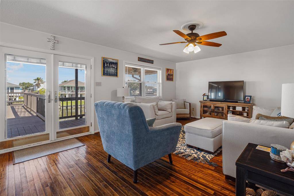 As you enter the home you immediately notice the gorgeous hardwood floors, the natural lighting, and the comfortable living area. The room is large to hold plenty of furniture