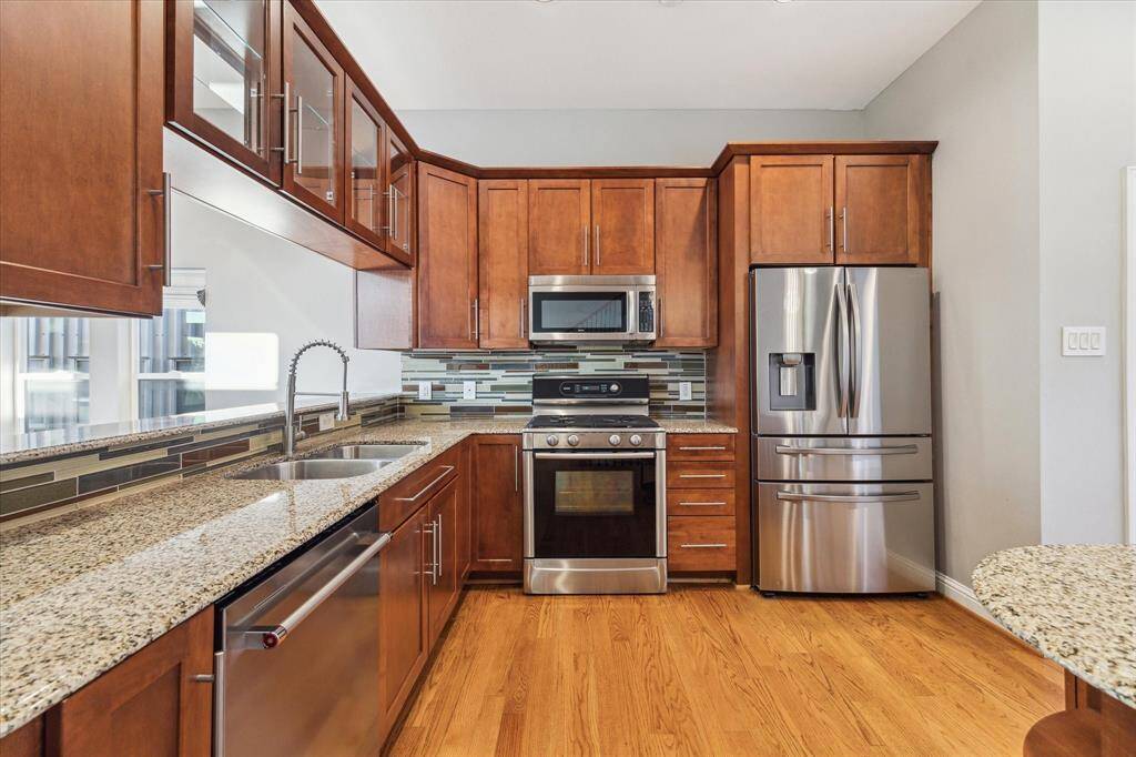 Second floor: This stunning kitchen offers the perfect blend of style and function, featuring gleaming granite countertops, premium Bosch appliances, and custom maple cabinetry with ample storage. It’s a space designed for both everyday living and effortless entertaining.