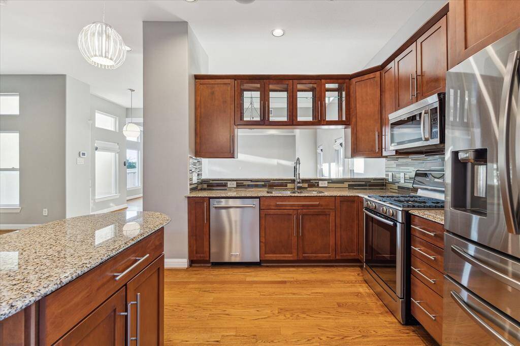 Second floor: The built-in island adds valuable countertop space along with additional storage below. Its open design offers a clear view into the living area, keeping the kitchen seamlessly connected to the heart of the home.