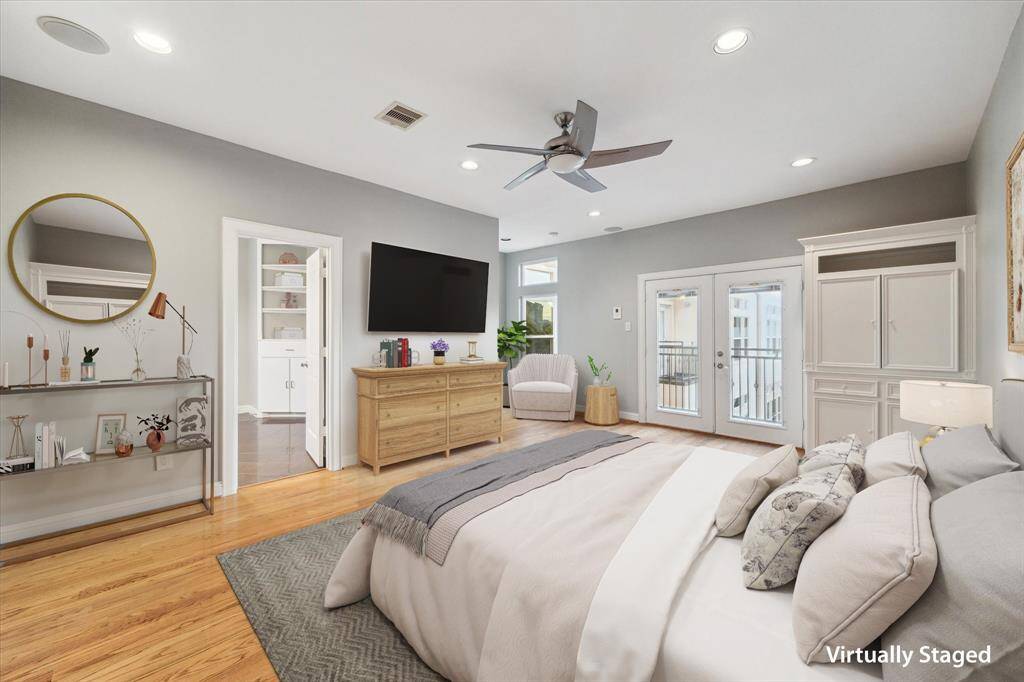 Third floor: The expansive primary suite features oak hardwood floors, soaring ceilings, custom built-ins, and its own private balcony—your perfect retreat.
