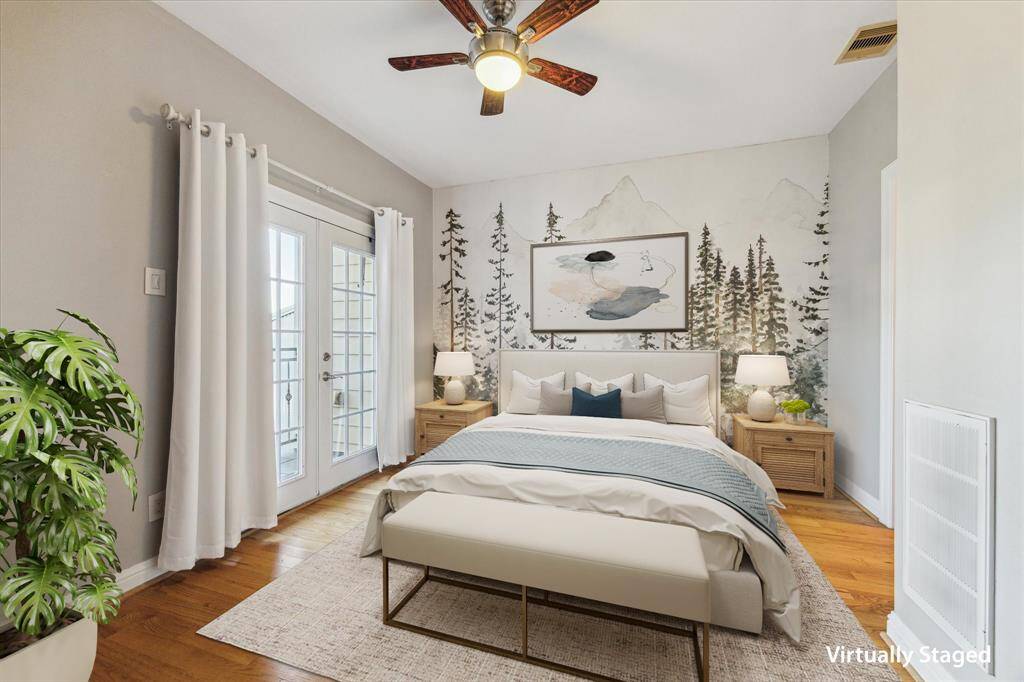 Third floor: This generously sized bedroom features rich hardwood floors, a private balcony for fresh air and relaxation, and a beautifully appointed en suite bath for added comfort and privacy.