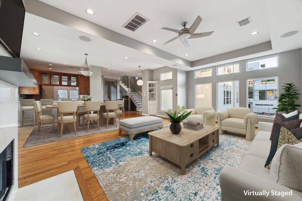 Second floor: A dramatic wall of windows floods the space with natural light, while soaring ceilings amplify the sense of openness. Built-in speakers make it perfect for entertaining.