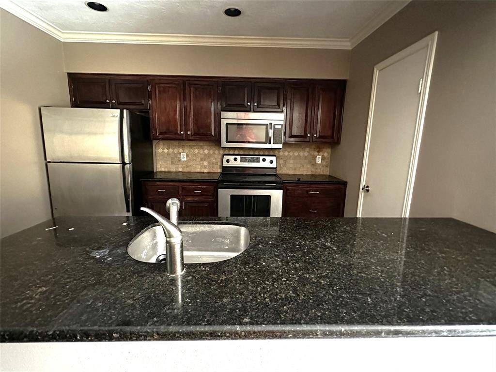 Kitchen with granite countertops