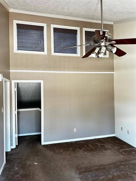 Large primary bedroom with high ceilings