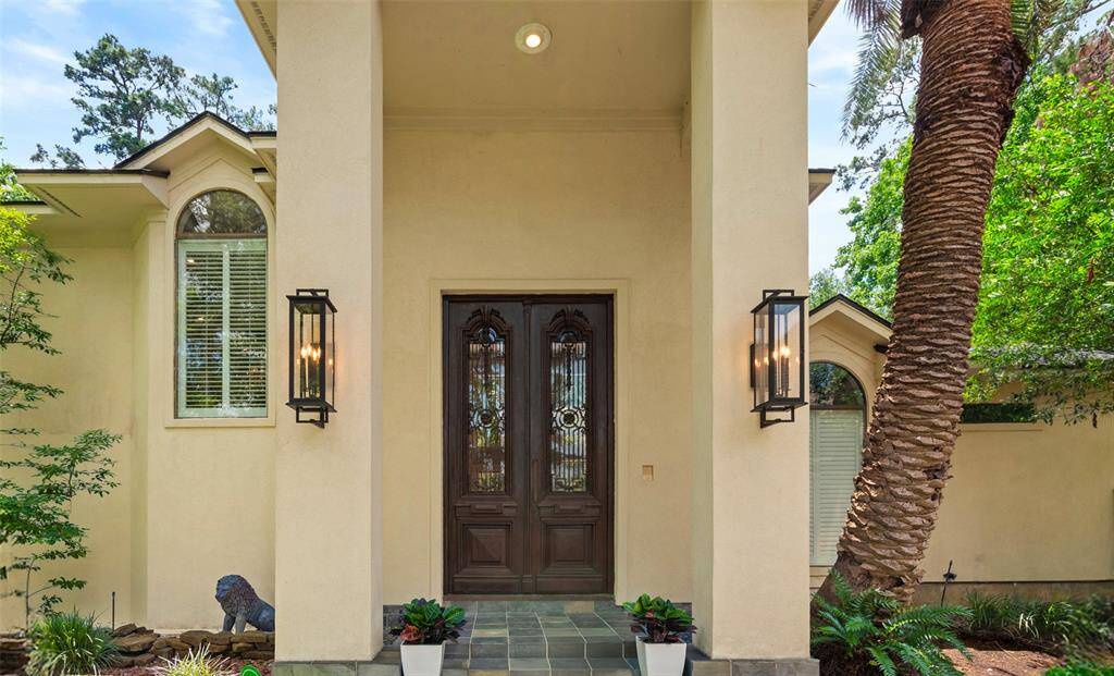 These lovely front doors came from a church in Argentina giving the elegance this stunning custom home needed.