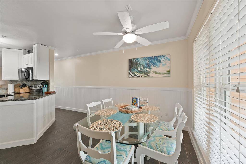 This bright and airy dining area overlooks lush green space, making every meal feel like a retreat.