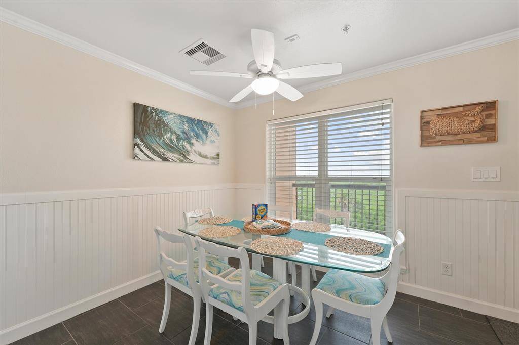 Bright and welcoming, this dining space is positioned just off the entry and filled with natural light from large windows.