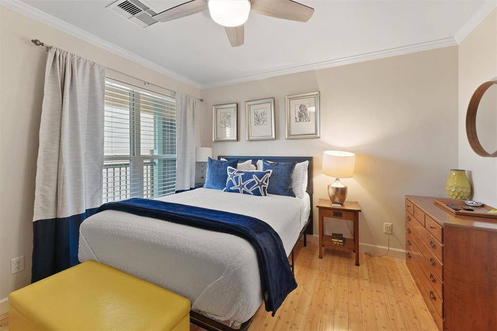 Coastal accents and soft natural light make this guest room both stylish and comfortable.