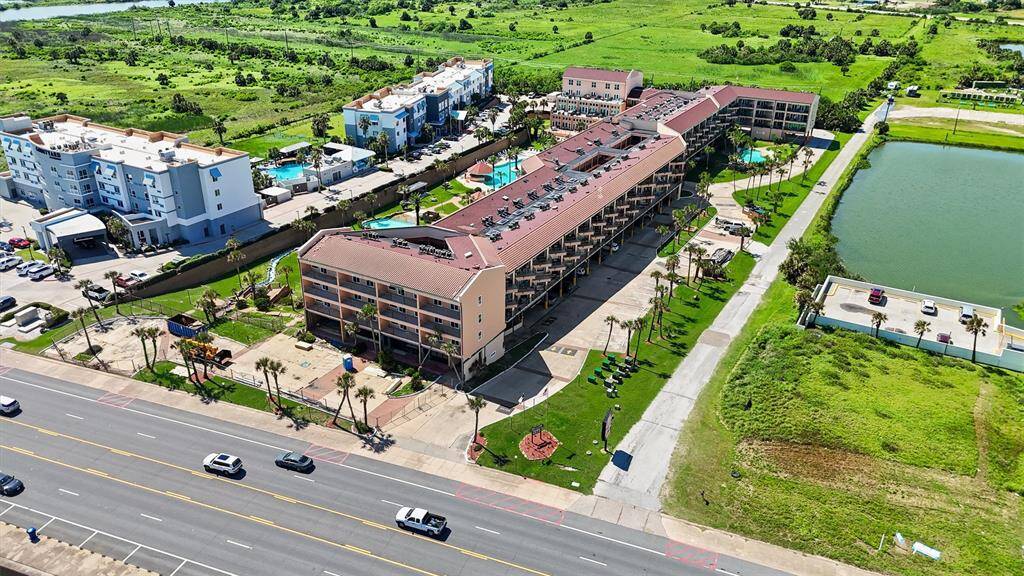 This vibrant, well-maintained complex is surrounded by lush greenery and sits in a prime location.