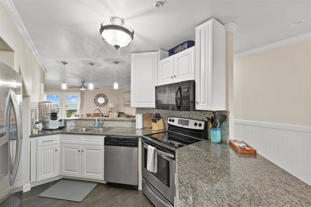 Enjoy coastal cooking with stainless steel appliances and an ocean view straight from your kitchen sink.
