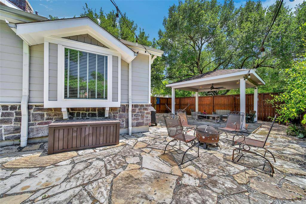 Additional covered back patio and fire pit which is great for hosting!