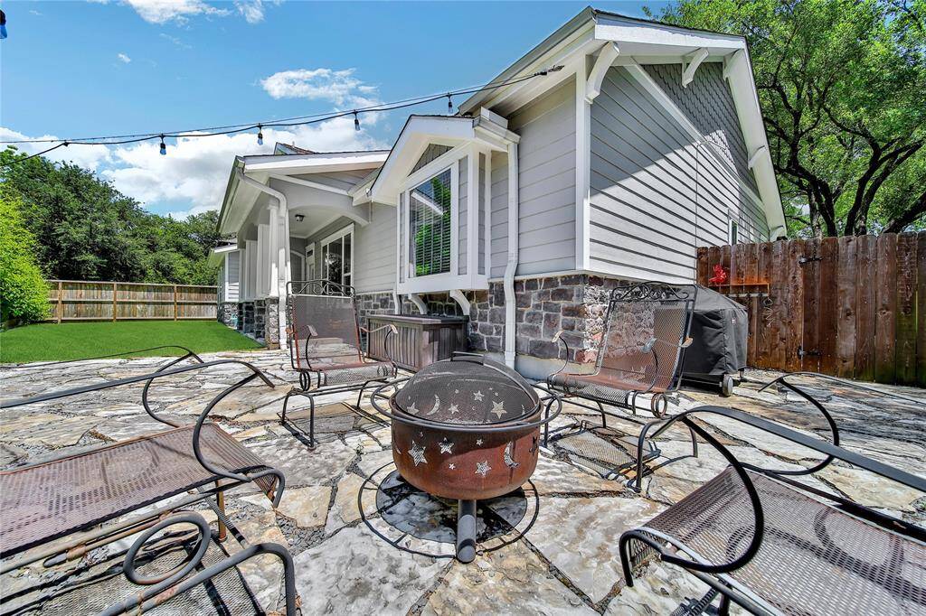 Additional covered back patio and fire pit which is great for hosting!