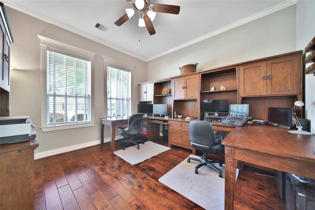 Downstairs features a spacious home office which could also function as a playroom!