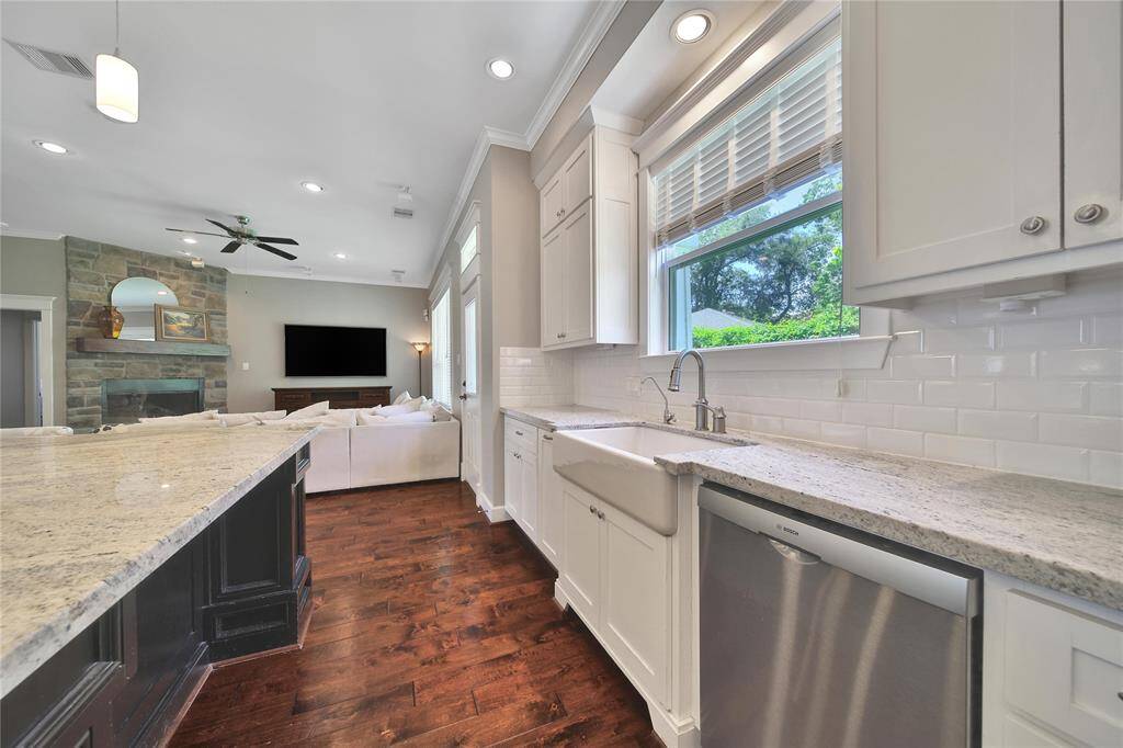 Functional kitchen space features updated appliances, gas stove, plenty of storage.
