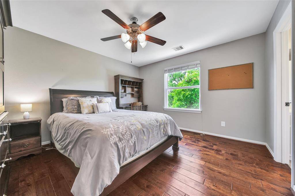 Upstairs secondary bedroom with ensuite bathroom and walk in closet.