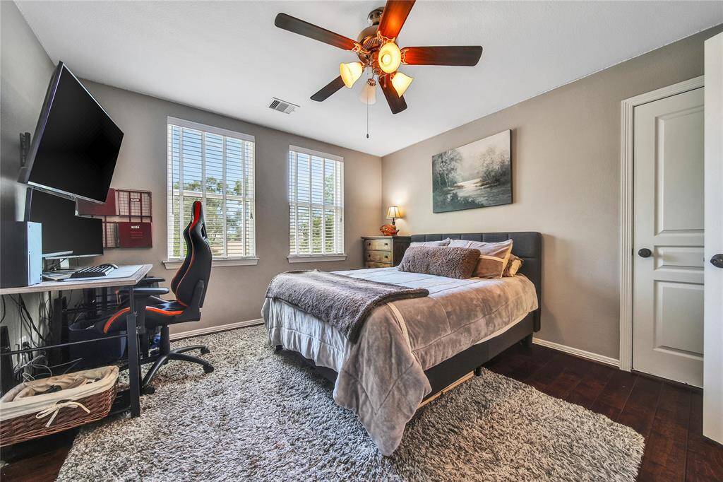 Upstairs secondary bedroom with ensuite bathroom and walk in closet.