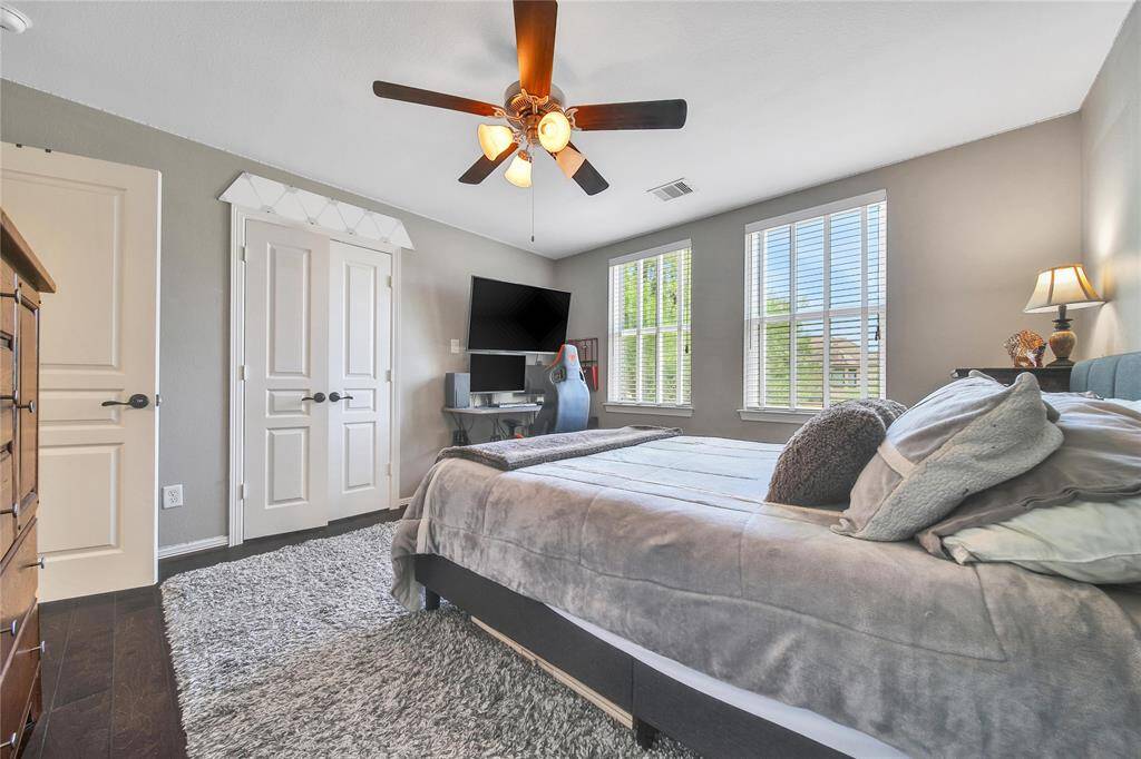 Upstairs secondary bedroom with ensuite bathroom and walk in closet.