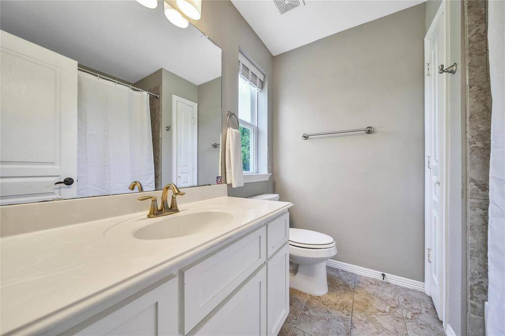 Upstairs secondary bathroom with tub/shower combo.