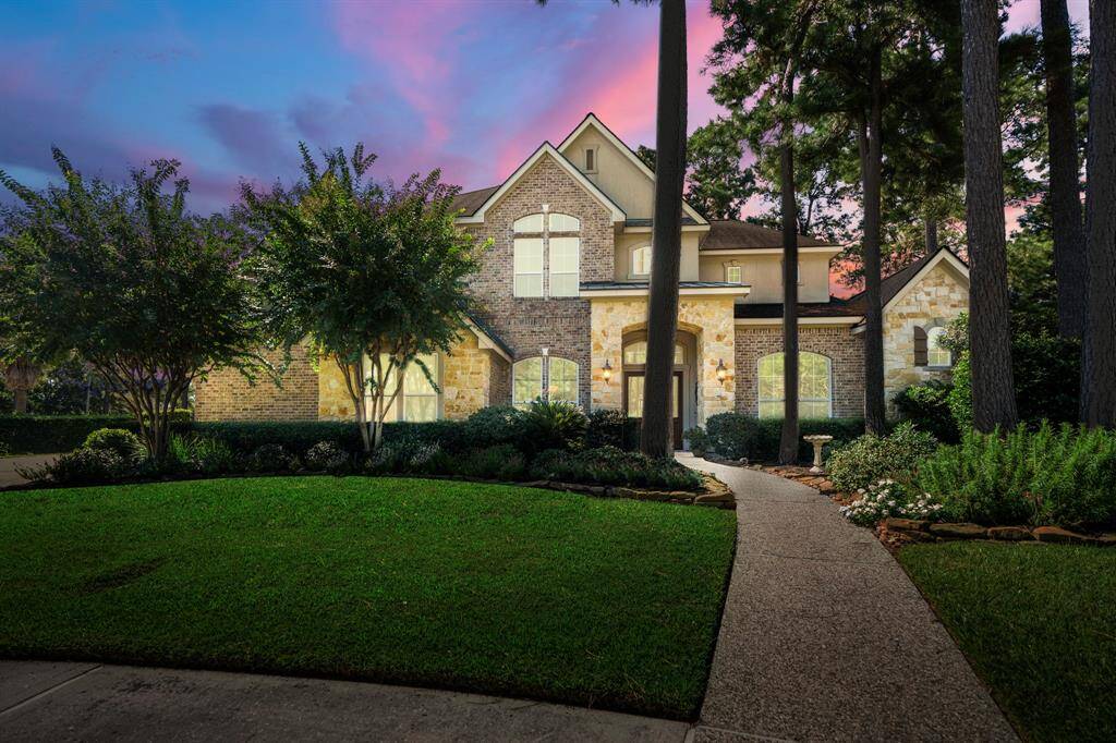 This custom home offers a blend of classic and timeless living in an ideal location overlooking a beautifully landscaped garden, creating a seamless indoor and outdoor connection in premier master planned golf community.