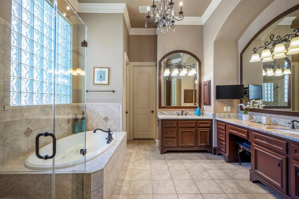 The tranquil tones of this luxurious bathroom create a relaxing ambiance that is both modern and functional.