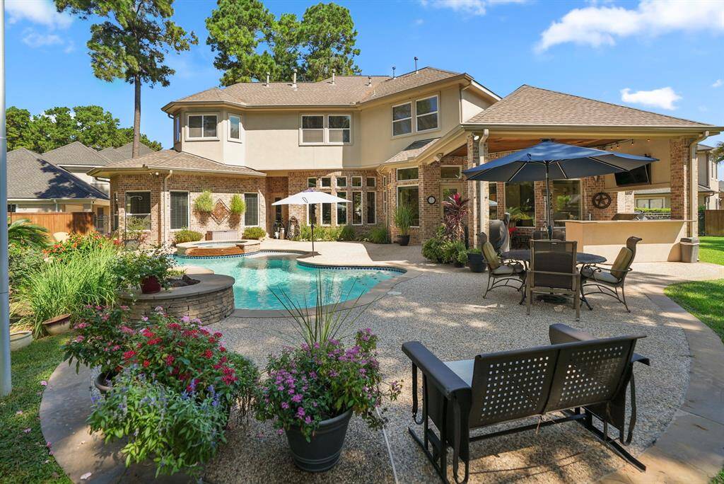 Enjoy entertaining with a full barbeque grill as well as bar area that leads out onto the grassy area. This home sits on a large lot that offers plenty of place to play end enjoy.