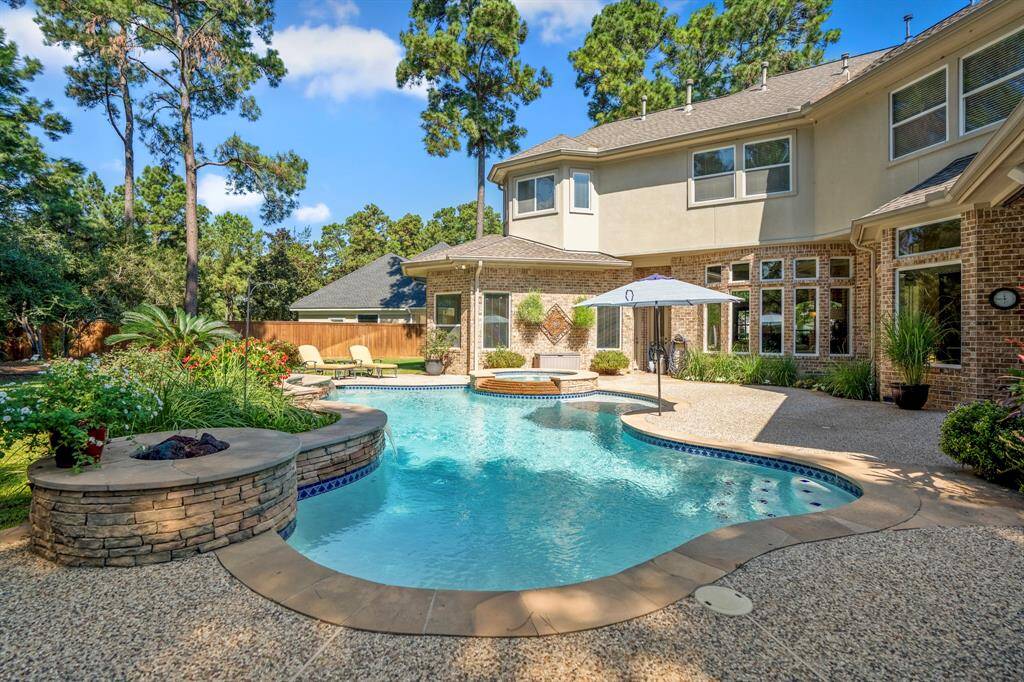 A view of the back of the property, with plenty of room for several seating areas, or places to lounge out on those summer days, as well as plenty of grassy areas for children and pets to play.