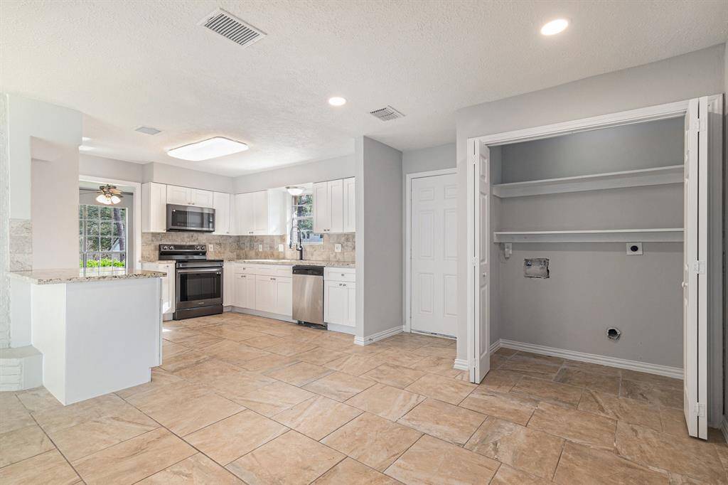 Just off the kitchen you'll have easy access to laundry.