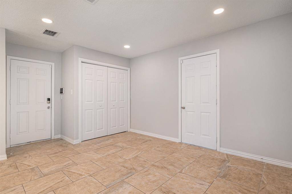 A view of the large breakfast area with the laundry room doors closed.