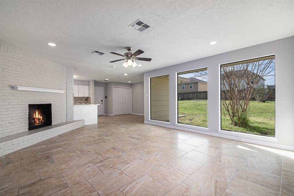 So bright and open! The picture windows offer plenty of natural light into your living space. The wood-burning fireplace is perfect for chilly evenings.