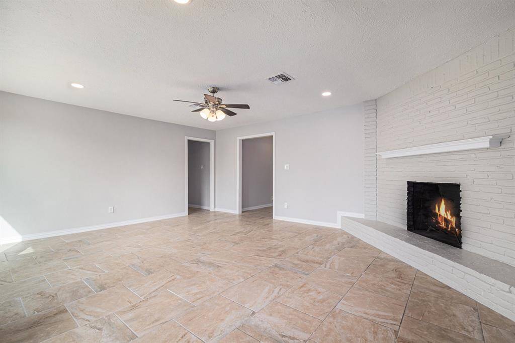 The spacious living room can accommodate just about any comfy furniture