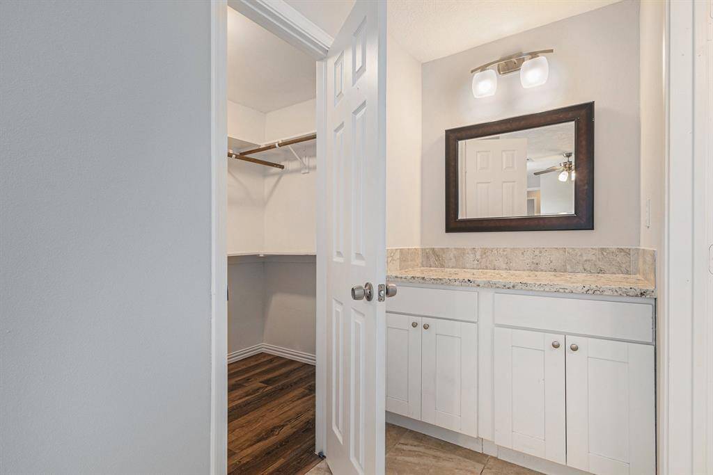 The walk-in closet is incredibly spacious and separate from the primary bath. The separate vanity allows for extra space and privacy.