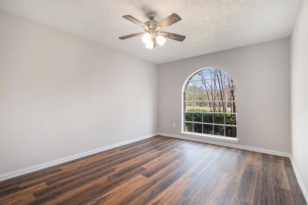 All secondary bedrooms feature luxury vinyl plank flooring and ceiling fans.