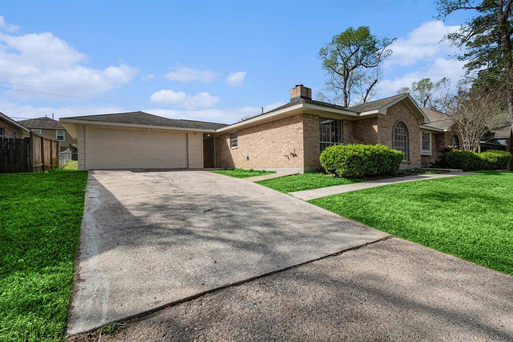 The double driveway leads to the detached garage & leaves plenty of room for multiple vehicles.