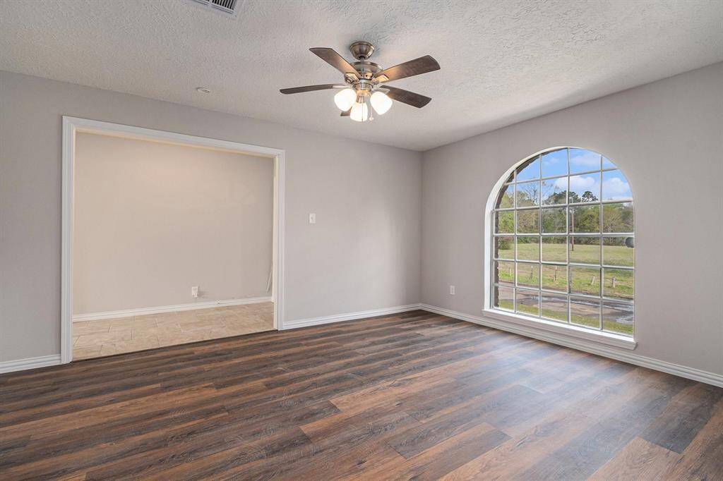As you enter the home, you'll step into a roomy entryway. Immediately to the left is a space ideal for a home office, study, formal living, or playroom.