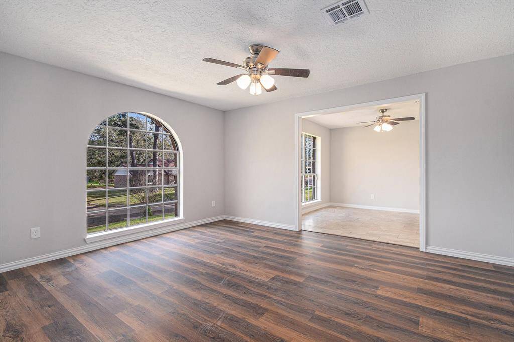 This view from the study area leads into the formal dining room, both overlooking the front yard.