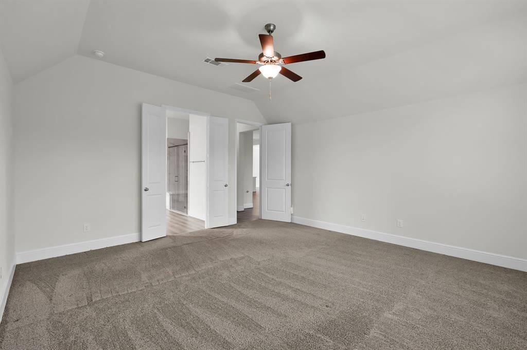 The primary suite features an en suite bath, oversized walk in closet, and amazing views of the preserve
