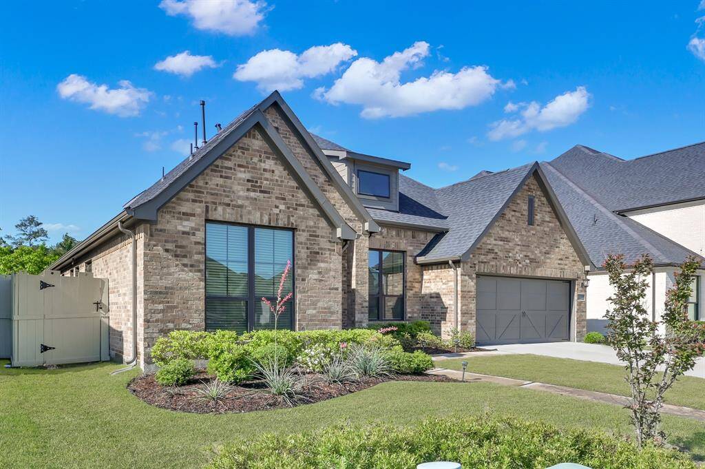 The well maintained and lush landscaping greet you and make an striking impression
