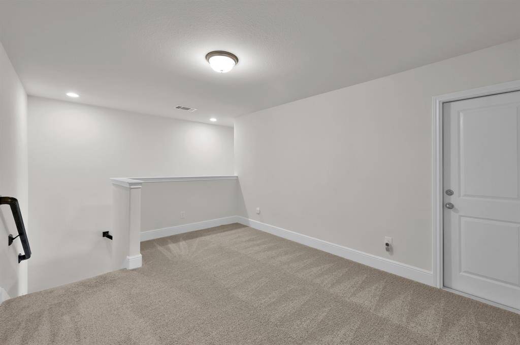 Upstairs features a functional space that can be utilized as a game room