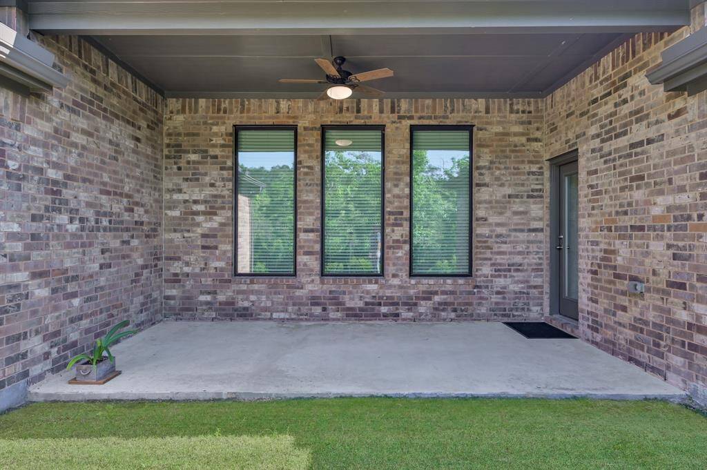 Covered patio with views of the backyard and preserve