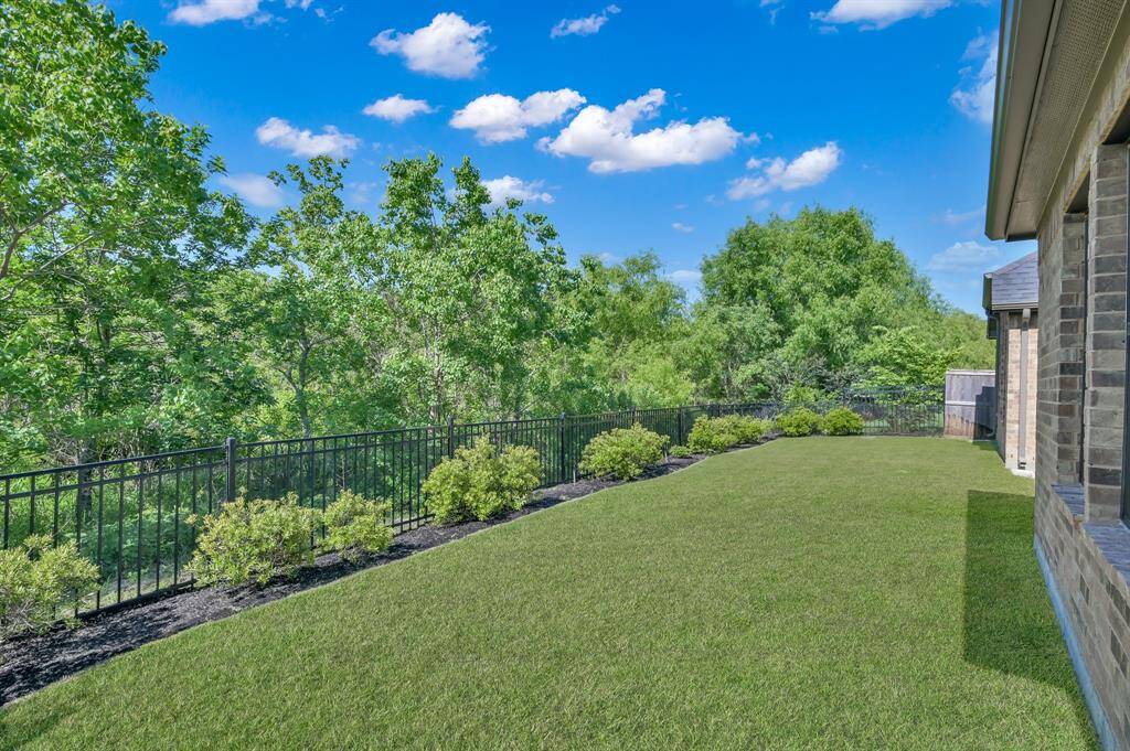 Enjoy the serenity of nature, birds chirping, and wildlife on the preserve from the comfort of the spacious covered patio