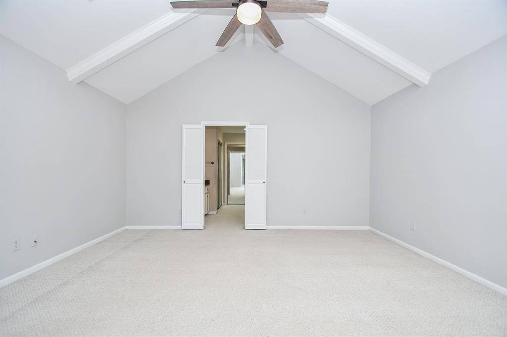 The primary bedroom with its vaulted ceiling gives you so much space.